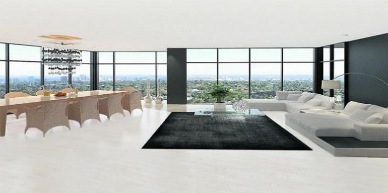 Sala con ventanal tapete negro muebles blancos