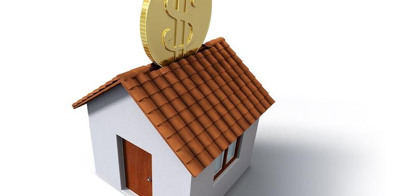 Casa con moneda encima
